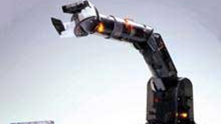 Remote Controlled Robot Arm Can Build Very Tiny Cars